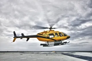 Posterazzi A Bell 407 utility helicopter prepares to land on the helipad of an oil rig Poster Print, (34 x 22)